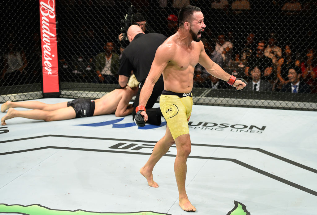 SAITAMA, JAPAN - SEPTEMBER 22: (R-L) Jussier Formiga of Brazil celebrates his submission victory over Ulka Sasaki of Japan in their featherweight bout during the UFC Fight Night event inside the Saitama Super Arena on September 22, 2017 in Saitama, Japan. (Photo by Jeff Bottari/Zuffa LLC)