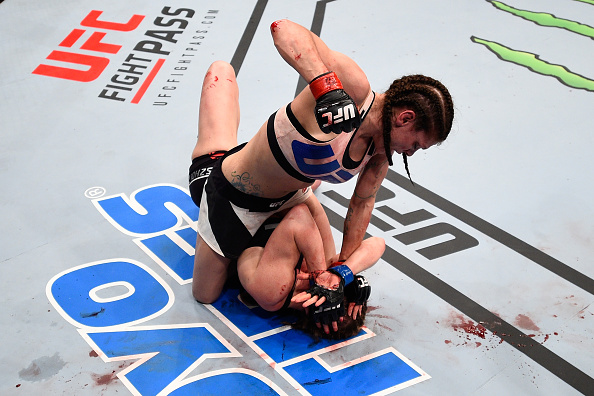 Lauren Murphy (top) punches Faszholz in their women's bantamweight bout during the UFC Fight Night event at Consol Energy Center on February 21, 2016 in Pittsburgh, PA. (Photo by Jeff Bottari/Zuffa LLC)