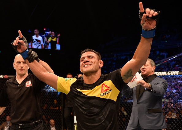 Dos Anjos celebrates after defeating Tarec Saffiedine in his welterweight debut at Fight Night Singapore