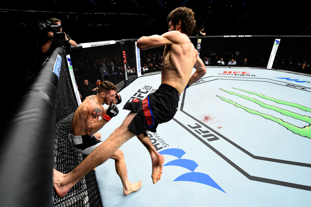 ROTTERDAM, NETHERLANDS - SEPTEMBER 02: (R-L) Zabit Magomedsharipov of Russia jumps off the wall of the Octagon to kick Mike Santiago in their featherweight bout during the UFC Fight Night event at the Rotterdam Ahoy on September 2, 2017 in Rotterdam, Netherlands. (Photo by Josh Hedges/Zuffa LLC)