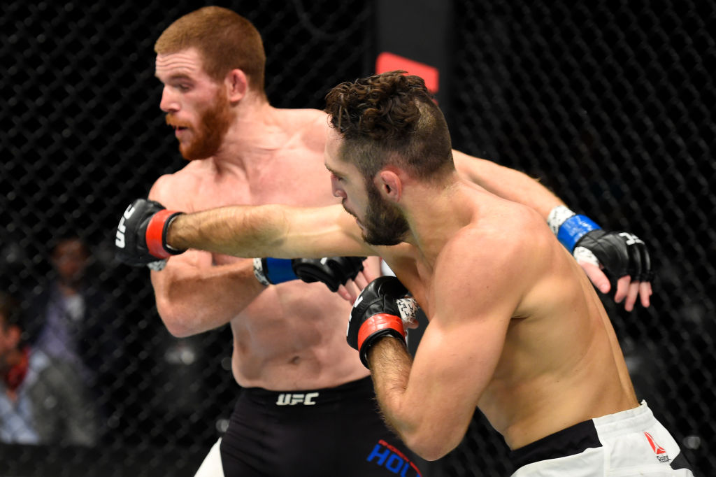 ROTTERDAM, NETHERLANDS - SEPTEMBER 02: (R-L) Thibault Gouti of France punches Andrew Holbrook in their lightweight bout during the UFC Fight Night event at the Rotterdam Ahoy on September 2, 2017 in Rotterdam, Netherlands. (Photo by Josh Hedges/Zuffa LLC)