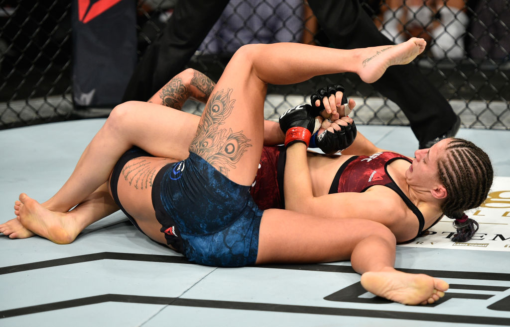 Sarah Moras attempts to submit Ashlee Evans-Smith at UFC 215