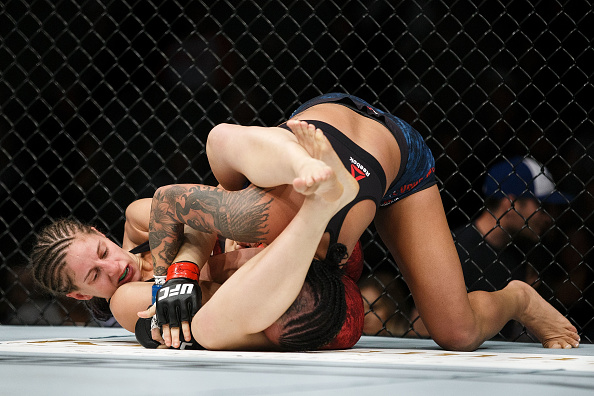 EDMONTON, AB - SEPTEMBER 09: Sarah Moras, left, fights Ashley Evans-Smith during UFC 215 at Rogers Place on September 9, 2017 in Edmonton, Canada. (Photo by Codie McLachlan/Getty Images)” align=