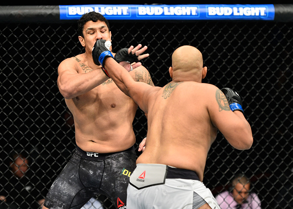  EDMONTON, AB - SEPTEMBER 09: (R-L) Arjan Singh Bhullar of Canada punches Luis Henrique of Brazil in their heavyweight bout during the UFC 215 event inside the Rogers Place on September 9, 2017 in Edmonton, Alberta, Canada. (Photo by Jeff Bottari/Zuffa LLC/Zuffa LLC via Getty Images)