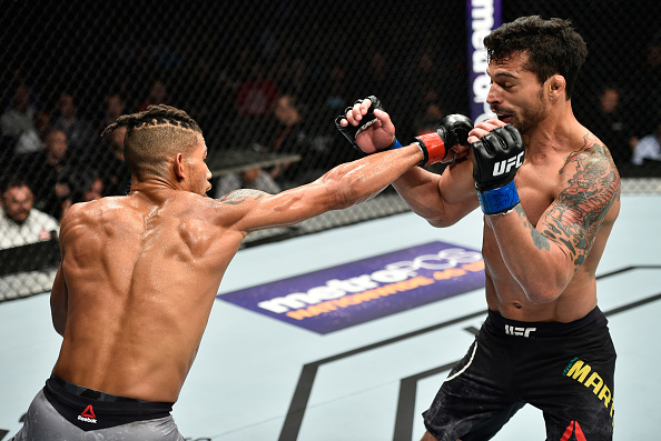 EDMONTON, AB - SEPTEMBER 09: (L-R) Kajan Johnson of Canada punches Adriano Martins of Brazil in their lightweight bout during the UFC 215 event inside the Rogers Place on September 9, 2017 in Edmonton, Alberta, Canada. (Photo by Jeff Bottari/Zuffa LLC/Zuffa LLC via Getty Images)