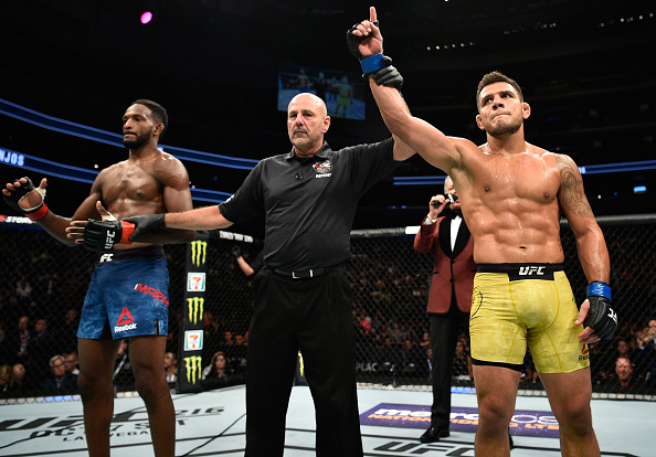 EDMONTON, AB - SEPTEMBER 09: (R-L) Rafael Dos Anjos of Brazil celebrates his submission victory over Neil Magny in their welterweight bout during the UFC 215 event inside the Rogers Place on September 9, 2017 in Edmonton, Alberta, Canada. (Photo by Jeff Bottari/Zuffa LLC/Zuffa LLC via Getty Images)