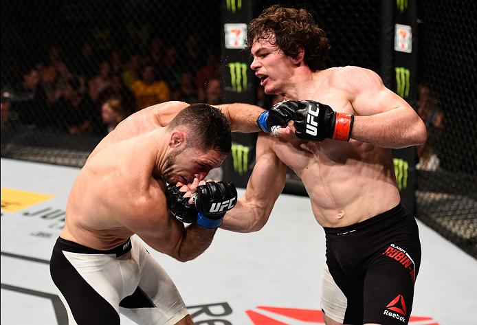 (R-L) Olivier Aubin-Mercier of Canada punches Thibault Gouti of France in their lightweight bout during the UFC Fight Night event inside the TD Place Arena on June 18, 2016 in Ottawa, Ontario, Canada. (Photo by Jeff Bottari/Zuffa LLC)