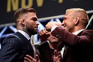 (L-R) Opponents <a href='../fighter/cody-garbrandt'>Cody Garbrandt</a> and <a href='../fighter/TJ-Dillashaw'>TJ Dillashaw</a> face off during the UFC 217 news conference inside T-Mobile Arena on October 6, 2017 in Las Vegas, Nevada. (Photo by Brandon Magnus/Zuffa LLC)“ align=“right“/>Once again seated on opposite sides of UFC President Dana White, the middleweight champion and the returning former welterweight kingpin were joined on stage by the championship competitors that will hit the Octagon ahead of them four weeks from now in New York City – women’s strawweight titleholder <a href=