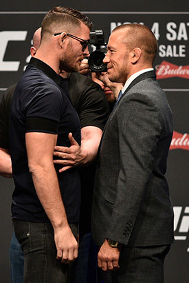 (L-R) Opponents Michael Bisping and Georges St-Pierre face off during the UFC 217 news conference inside T-Mobile Arena on October 6, 2017 in Las Vegas, Nevada. (Photo by Jeff Bottari/Zuffa LLC)