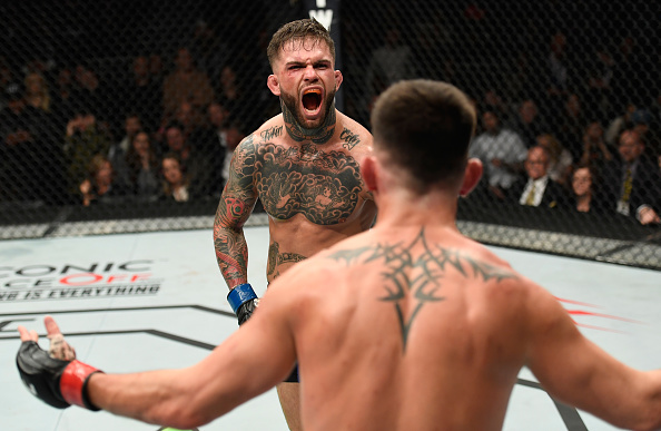 (L-R) Dominick Cruz taunts Cody Garbrandt in their UFC bantamweight championship bout during the UFC 207 event at T-Mobile Arena on December 30, 2016 in Las Vegas, Nevada. (Photo by Josh Hedges/Zuffa LLC)