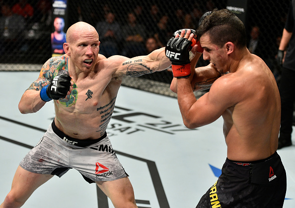 GDANSK, POLAND - OCTOBER 21: (L-R) Josh Emmett punches Felipe Arantes of Brazil in their featherweight bout during the UFC Fight Night event inside Ergo Arena on October 21, 2017 in Gdansk, Poland. (Photo by Jeff Bottari/Zuffa LLC)