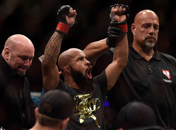 <a href='../fighter/Demetrious-Johnson'>Demetrious Johnson</a> celebrates after his submission victory over <a href='../fighter/Ray-Borg'>Ray Borg</a> in their UFC flyweight championship bout during the UFC 216 event inside T-Mobile Arena on October 7, 2017 in Las Vegas, Nevada. (Photo by Brandon Magnus/Zuffa LLC)“ align=“center“/>Just one day before he vanquished Ray Borg for an eleventh and record-breaking defense of his flyweight belt, and after taking selfies and signing autographs with every single fan in attendance, the ever-accessible Demetrious Johnson spent his obligatory few moments with the media following open workouts for UFC 216. He wasn’t sure why. He asked openly what they could possibly have to ask him. After all, his appearance at UFC 216 as the co-main was a mere backup plan to scrapped bout that should have headlined UFC 215, meaning these media appearances had ostensibly been going on for two months, what new was there left to say?<p>But one question did seem to capture his imagination, if only for a moment. With a win, given his humble approach, would he even be able to allow himself to enjoy his new record? He stared into space for a moment and tried to imagine what that would look like.</p><p>„I’ll get to my new house…turn on the fireplace…have a delicious beer in my hand and be like „ah, this is what it feels like.“</p><blockquote class=