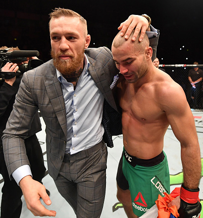 Lobov celebrates a victory over <a href='../fighter/teruto-ishihara'>Teruto Ishihara</a> with his teammate <a href='../fighter/Conor-McGregor'>Conor McGregor</a&gt