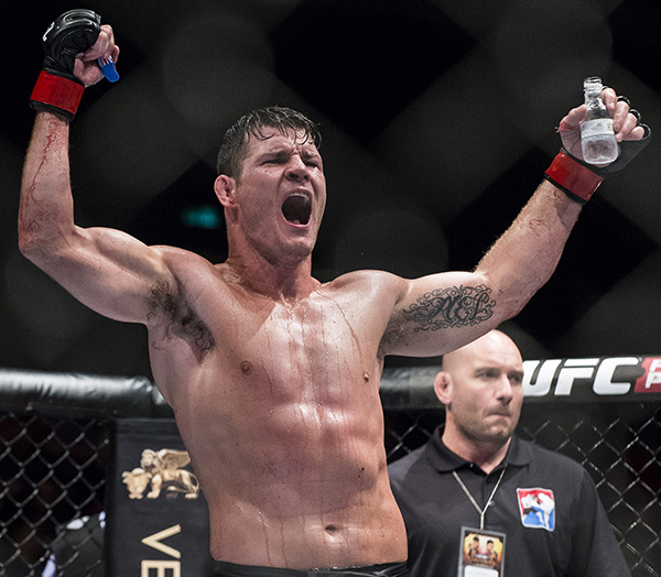 Michael Bisping celebrates after winning his middleweight fight against Cung Le of USA during the UFC Fight Night at The Venetian Macao Cotai Arena on August 23, 2014 in Macau, China. (Photo by Victor Fraile/Getty Images)