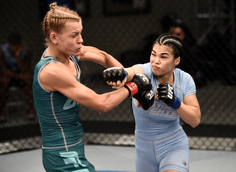 Rachael Ostovich-Berdon punches Melinda Fabian in Round 1 of their bout on The Ultimate Fighter