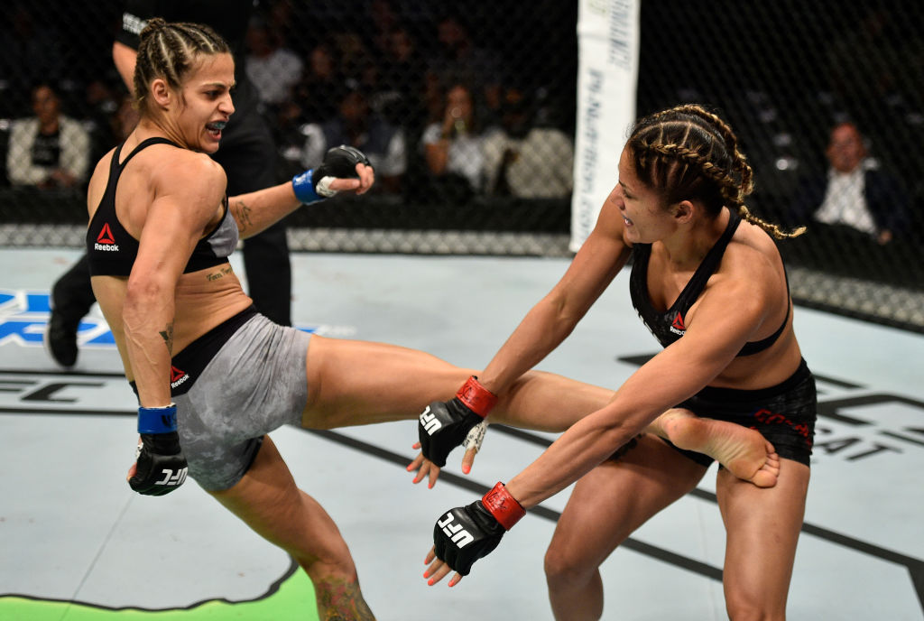 LAS VEGAS, NV - OCTOBER 07: (L-R) Poliana Botelho of Brazil kicks Pearl Gonzalez in their womens strawweight bout during the UFC 216 event inside T-Mobile Arena on October 7, 2017 in Las Vegas, Nevada. (Photo by Jeff Bottari/Zuffa LLC)