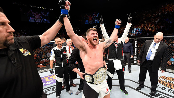 INGLEWOOD, CA - JUNE 04: Michael Bisping celebrates after his first round knockout win against Luke Rockhold in their UFC middleweight championship bout during the UFC 199 event at The Forum. (Photo by Josh Hedges/Zuffa LLC)