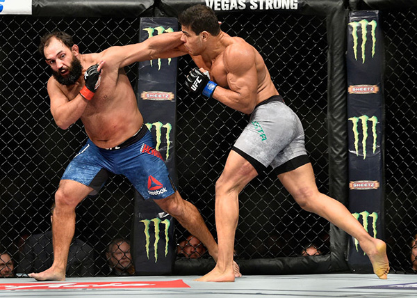 NEW YORK, NY - NOVEMBER 04: <a href='../fighter/paulo-henrique-costa'>Paulo Costa</a> of Brazil fights <a href='../fighter/Johny-Hendricks'>Johny Hendricks</a> in their middleweight bout during the UFC 217 event at Madison Square Garden on November 4, 2017 in New York City. (Photo by Jeff Bottari/Zuffa LLC)“ align=“center“/><br />NEW YORK – Brazilian middleweight phenom Paulo Costa made a statement in his third trip to the Octagon, as he opened up the UFC 217 main card on Saturday with a one-sided second-round stoppage of former welterweight champion Johny Hendricks at Madison Square Garden.<p>“I came to show the world who I am,” said the 26-year-old. “This is the new time.”</p><p>Costa opened up with hard kicks to the leg and body, immediately getting Hendricks’ attention, but when he went upstairs with a pair of kicks, “Bigg Rigg” tried to even the score, but his first takedown attempt came up empty. As the round progressed, Costa continued to land thudding blows with only a sporadic response from Hendricks, who couldn’t keep the prospect off him for long.</p><p>Keeping the pressure on in the second, every shot thrown by Costa was designed to end the fight, and after Hendricks took more and more punishment, referee John McCarty determined that the Oklahoma native had seen enough, stopping the fight at 1:23 of round two.</p><p>“He’s a tough guy,” Costa said of Hendricks, who is now 1-5 in his last six. “It’s not easy to fight against a former champion.”</p><p>Costa moves to 11-0 with the win. Hendricks falls to 18-8.</p></div></div><footer><div class=