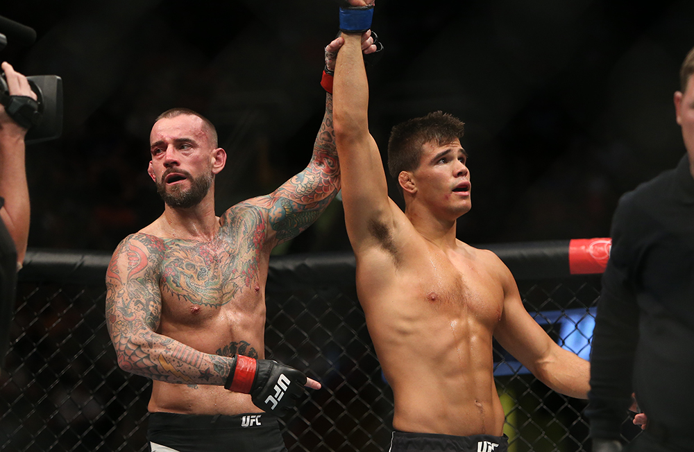 Mickey Gall and CM Punk pose together after their fight at UFC 203