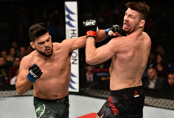 SHANGHAI, CHINA - NOVEMBER 25: Kelvin Gastelum punches Michael Bisping of England in their middleweight bout during the UFC Fight Night event inside the Mercedes-Benz Arena on November 25, 2017 in Shanghai, China. (Photo by Brandon Magnus/Zuffa LLC via Getty Images)