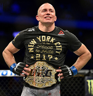 Georges St-Pierre of Canada celebrates after defeating Michael Bisping of England in their UFC middleweight championship bout during the UFC 217 event inside Madison Square Garden on November 4, 2017 in New York City. (Photo by Jeff Bottari/Zuffa LLC)