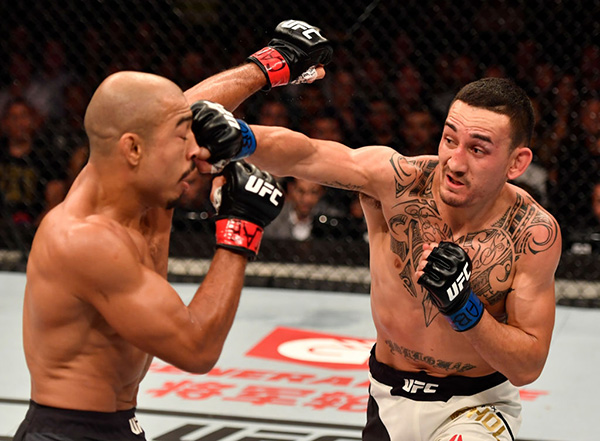<a href='../fighter/Max-Holloway'>Max Holloway</a> punches <a href='../fighter/Jose-Aldo'>Jose Aldo</a> of Brazil in their UFC featherweight championship bout during the UFC 212 event at Jeunesse Arena on June 3, 2017 in Rio de Janeiro, Brazil. (Photo by Jeff Bottari/Zuffa LLC)“ align=“center“/> UFC featherweight champion Max Holloway didn’t blink when informed that <a href=
