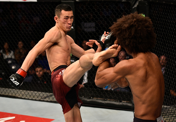 SHANGHAI, CHINA - NOVEMBER 25: (L-R) Wang Guan of China kicks Alex Caceres in their featherweight bout during the UFC Fight Night event inside the Mercedes-Benz Arena on November 25, 2017 in Shanghai, China. (Photo by Brandon Magnus/Zuffa LLC via Getty Images)