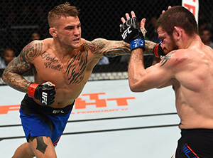 Dustin Poirier punches Jim Miller in their lightweight bout during the UFC 208 event inside Barclays Center on Feb. 11, 2017 in Brooklyn, NY (Photo by Jeff Bottari/Zuffa LLC)