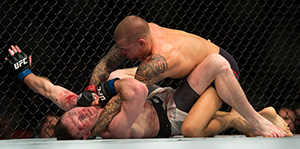 Dustin Poirier (top) punches Joe Duffy of Ireland in their lightweight bout during the UFC 195 event inside MGM Grand Garden Arena on Jan. 2, 2016 in Las Vegas, NV. (Photo by Brandon Magnus/Zuffa LLC)