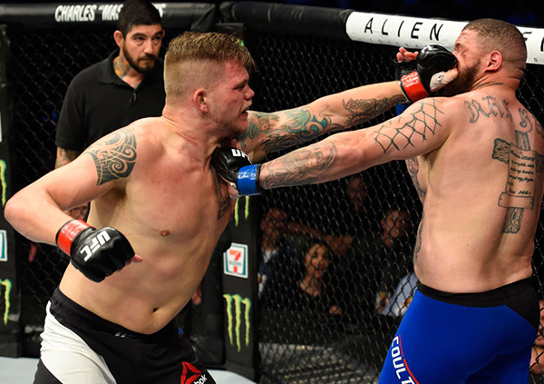 Chase Sherman punches Rashad Coulter in their heavyweight fight during the UFC 211 event at the American Airlines Center on May 13, 2017 in Dallas, Texas. (Photo by Josh Hedges/Zuffa LLC)