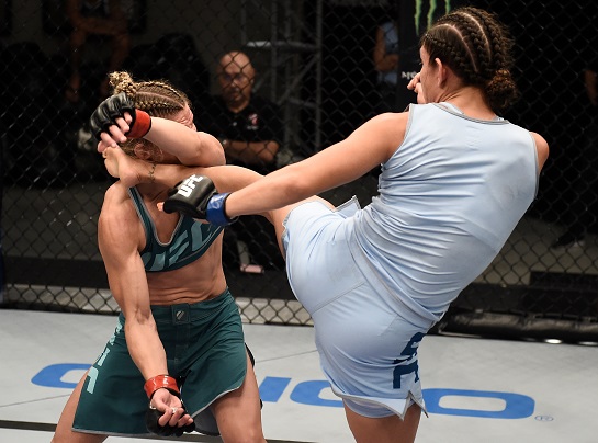 Nicco Montano kicks Barb Honchak during their semifinal matchup