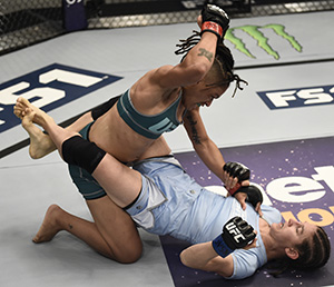 Sijara Eubanks punches Roxanne Modafferi (Photo by Brandon Magnus/Zuffa LLC)