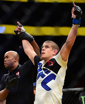 Joe Lauzon (right) reacts to his victory over Diego Sanchez (left) in their lightweight bout during the UFC 200 event on July 9, 2016 at T-Mobile Arena in Las Vegas, Nevada. (Photo by Harry How/Zuffa LLC)