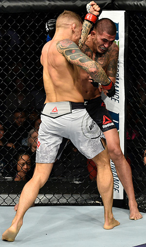 Dustin Poirier punches Anthony Pettis in their lightweight bout during the UFC Fight Night event inside the Ted Constant Convention Center on November 11, 2017 in Norfolk, Virginia. (Photo by Brandon Magnus/Zuffa LLC)