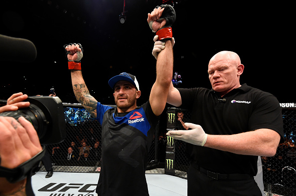 Alexander Volkanovski celebrates after defeating Mizuto Hirota in their featherweight bout at Fight Night Auckland