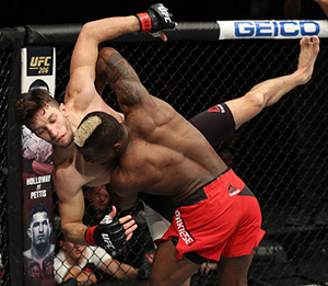 Marc Diakiese of England takes down Frankie Perez during the UFC Fight Night event at the Times Union Center on December 9, 2016 in Albany, New York. (Photo by Patrick Smith/Zuffa LLC)