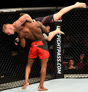 (R-L) Marc Diakiese takes down Lukasz Sajewski o during the UFC 204 Fight Night at the Manchester Evening News Arena on October 8, 2016 in Manchester, England. (Photo by Josh Hedges/Zuffa LLC)