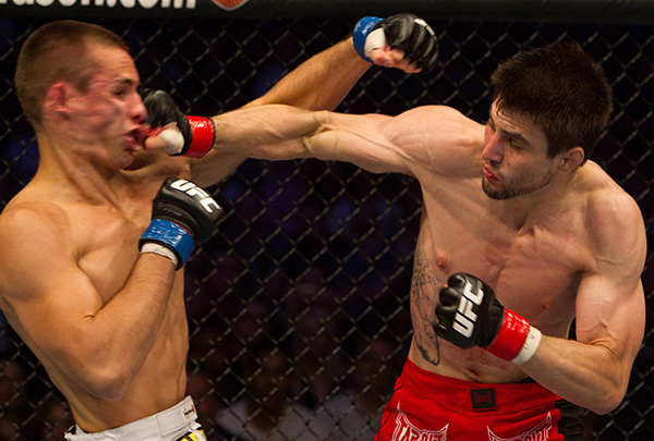Carlos Condit (red shorts) def. Rory MacDonald (white shorts) - TKO - 4:53 round 3 during UFC 115 at GM Place on June 12, 2010 in Vancouver, Canada. (Photo by Josh Hedges/Zuffa LLC)