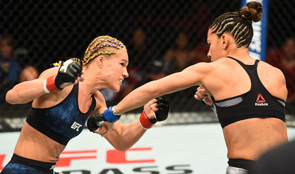 <a href='../fighter/Felice-Herrig'>Felice Herrig</a> and <a href='../fighter/cortney-casey'>Cortney Casey</a> exchange punches in their women’s strawweight bout during the UFC 218 event inside Little Caesars Arena on December 02, 2017 in Detroit, Michigan. (Photo by Josh Hedges/Zuffa LLC)“ align=“center“/> In a meeting of strawweight contenders, Felice Herrig extended her winning streak to four with a split decision victory over Cortney Casey.</p><p>Evenly matched on paper, Herrig and Casey lived up to those expectations in their fight, with very little to separate the two over 15 minutes as they battled on the feet throughout all three rounds. Herrig did pick up a takedown in the first round, but a Casey reversal evened things up quickly. Over the next two frames, it was nip and tuck, and while Herrig took some hard shots, she delivered more than a few of her own, nearly closing her foe’s left eye before the final horn.</p><p>With the win, the No. 9-ranked Herrig improves to 14-6. The No. 11-ranked Casey falls to 7-5.</p><p><strong>COOPER vs MAGANA</strong></p><p><img class=
