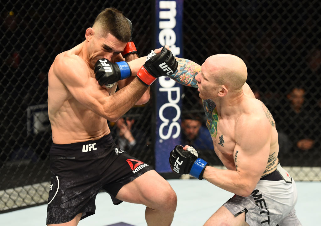 WINNIPEG, CANADA - DECEMBER 16: (R-L) Josh Emmett punches Ricardo Lamas in their featherweight bout during the UFC Fight Night event at Bell MTS Place on December 16, 2017 in Winnipeg, Manitoba, Canada. (Photo by Josh Hedges/Zuffa LLC)