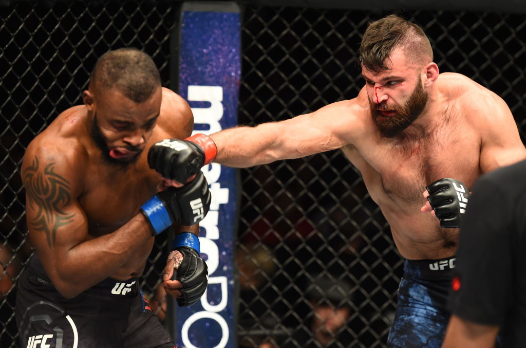 WINNIPEG, CANADA - DECEMBER 16: (R-L) Julian Marquez punches Darren Stewart of England in their middleweight bout during the UFC Fight Night event at Bell MTS Place on December 16, 2017 in Winnipeg, Manitoba, Canada. (Photo by Josh Hedges/Zuffa LLC)