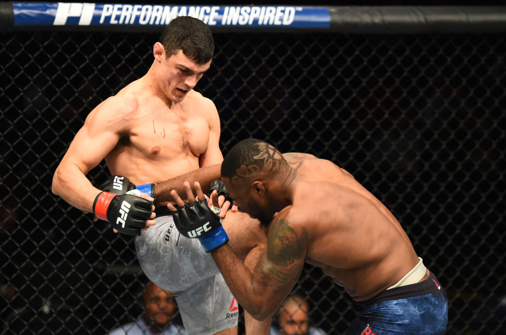 WINNIPEG, CANADA - DECEMBER 16: (L-R) Alessio Di Chirico of Italy knees Oluwale Bamgbose in their middleweight bout during the UFC Fight Night event at Bell MTS Place on December 16, 2017 in Winnipeg, Manitoba, Canada. (Photo by Josh Hedges/Zuffa LLC)