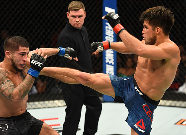 (R-L) <a href='../fighter/Henry-Cejudo'>Henry Cejudo</a> kicks <a href='../fighter/Sergio-Pettis'>Sergio Pettis</a> in their flyweight bout during the UFC 218 event inside Little Caesars Arena on December 02, 2017 in Detroit, Michigan. (Photo by Josh Hedges/Zuffa LLC)“ align=“center“/> Henry Cejudo was solid, yet unspectacular, in winning a shutout three-round unanimous decision over Sergio Pettis in their clash of top five flyweights.</p><p>After showing off his striking in his recent win over <a href=