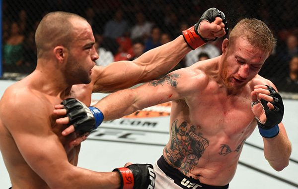  (L-R) <a href='../fighter/eddie-alvarez'>Eddie Alvarez</a> punches <a href='../fighter/Justin-Gaethje'>Justin Gaethje</a> in their lightweight bout during the UFC 218 event inside Little Caesars Arena on December 02, 2017 in Detroit, Michigan. (Photo by Josh Hedges/Zuffa LLC)“ align=“center“/> In a fight UFC fans had been waiting for ever since it was announced, Eddie Alvarez and Justin Gaethje delivered the goods and then some, with the former lightweight champion scoring a stirring third-round knockout over Gaethje, who suffered his first pro loss in the process.</p><p>Gaethje went after Alvarez’ legs with kicks to start the bout, and while Alvarez fired back with punches well, the kicks were having an effect almost immediately. Switching stances to deal with the kicks, Alvarez’ movement was being compromised and Gaethje just kept marching forward. Alvarez got a flash takedown with just over two minutes left, but Gaethje stood almost as soon as he hit the deck. Late in the round, Alvarez began digging to the body, and he also opened a cut over Gaethje’s left eye, capping off a strong finish for the former champ.</p><p>Alvarez had a solid second round, mainly focusing on the body attack that was taking its toll on Gaethje, but “The Underground King” didn’t abandon the head either, adding to his lead. Gaethje was far from finished though, and he barrage of return fire raised a huge swelling on the right side of Alvarez’ face late in the round.</p><p>Gaethje staggered Alvarez with another hard kick to the leg early in round three, and the Arizonan kept the heat on the leg as Alvarez attempted to keep his foe at bay with shots to the head. With a little under three minutes left, Alvarez dragged the fight to the mat but he couldn’t keep Gaethje there, and the leg assault continued. In response, Alvarez did his best to close the distance and keep Gaethje from having the room to operate, and as the Philadelphian got his wish, he landed a thudding right knee that sent Gaethje to the canvas. A follow up series of punches from Alvarez finished the job, with referee Herb Dean halting the bout at 3:59 of the third frame.</p><p>With the win, the No. 4-ranked Alvarez ups his record to 29-5 with 1 NC. The No. 5-ranked Gaethje falls to 18-1.</p><p><strong>TORRES vs WATERSON</strong></p><p><img class=