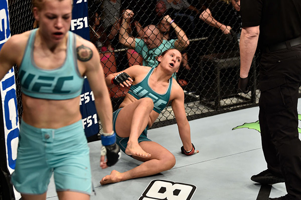 DeAnna Bennett struggles to get to her feet after suffering a knockdown at the end of the first round against Melinda Fábián of Hungary in their women's flyweight bout during the TUF Finale event inside Park Theater on December 01, 2017 in Las Vegas, Nevada. (Photo by Jeff Bottari/Zuffa LLC)