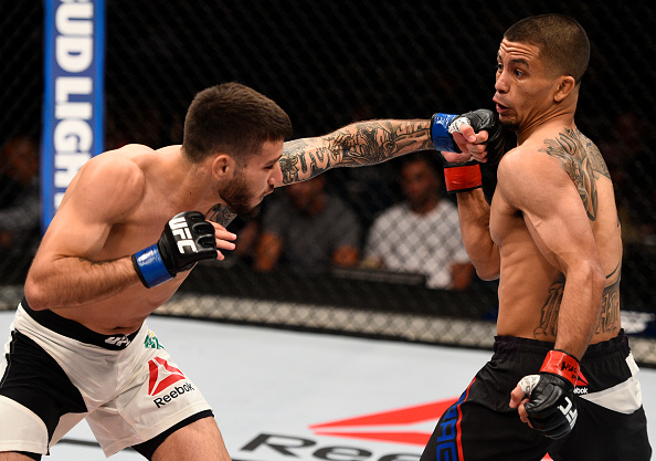 Matheus Nicolau punches John Moraga during their fight in July of 2016