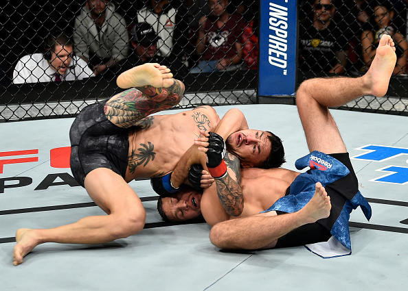 FRESNO, CA - DECEMBER 09: (R-L) Brian Ortega attempts to submit in their featherweight bout during the <a href='../event/UFC-Silva-vs-Irvin'>UFC Fight Night </a>event inside Save Mart Center on December 9, 2017 in Fresno, California. (Photo by Jeff Bottari/Zuffa LLC/Zuffa LLC via Getty Images)“ align=“center“/><p>It was a humble display from the 26-year-old after a memorable win on the most pressure-filled stage of his career.</p><p>The fighters traded kicks in the early going as a way of getting acquainted before a quick exchange in the second minute of the fight. Midway through the round, both started throwing more punches, getting a rise out of the crowd though neither fighter was able to put the other in any trouble. Swanson was starting to put some body punches in the bank, but out of nowhere, when the two locked up in the closing seconds, Ortega sunk in a tight choke that might have ended the fight if the horn didn’t intervene.</p><p>Swanson kept digging to the body in round two, but Ortega kept marching forward, now eager to implement his grappling game. With two minutes left, Ortega went all-in for another submission, and this time, he got it, as he locked in a guillotine choke and jumped guard. Swanson tried his best to get free, but it was not happening, forcing the veteran to tap out. The official time of the finish was 3:22.</p><p>With the win, the No. 6-ranked Ortega moves to 13-0 with 1 NC. The No. 4-ranked Swanson falls to 25-8.</p></div></div></div><footer><div class=