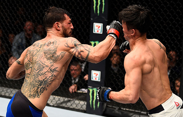 (L-R) Swanson punches <a href='../fighter/Dooho-Choi'>Dooho Choi</a> during UFC 206 event Dec. 10, 2016 in Toronto, ON. (Photo by Jeff Bottari/Zuffa LLC)“ align=“center“/><a href=