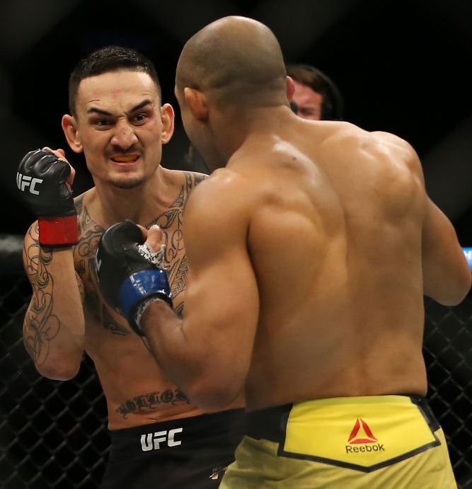 (R) <a href='../fighter/Jose-Aldo'>Jose Aldo</a> punches <a href='../fighter/Max-Holloway'>Max Holloway</a> during UFC 218 on December 2, 2017 in Detroit, Michigan. (Photo by Rey Del Rio/Zuffa LLC)“ align=“right“/> Held in Detroit, Michigan, the epic event was one of the most exciting and beloved fight cards of 2017, headlined by featherweight champ Max Holloway in his first title defense against the very man he won it from, Jose Aldo. The non-stop action also showcased heavyweights <a href=