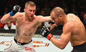 (L-R) Justin Gaethje punches <a href='../fighter/eddie-alvarez'>Eddie Alvarez</a> during the UFC 218 event December 02, 2017 in Detroit, Michigan. (Photo by Josh Hedges/Zuffa LLC)“ align=“left“/>The best thing you can say about Justin Gaethje is that his fighting style almost defies description. There’s a primal intensity to it that can’t be put into words, and that’s probably the way he likes it because it means you have to watch him to get a read on him. And watch him we did in 2017, as he parlayed a stellar 17-0 record and a World Series of Fighting title into a UFC contract in which he’s thus far put together a win over <a href=